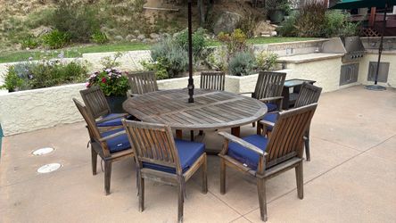 Oval Teak Table with 8 chairs and 2 lounge chairs/couch