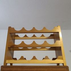 Wine Rack holds 12 bottles. Handmade w/ wood.