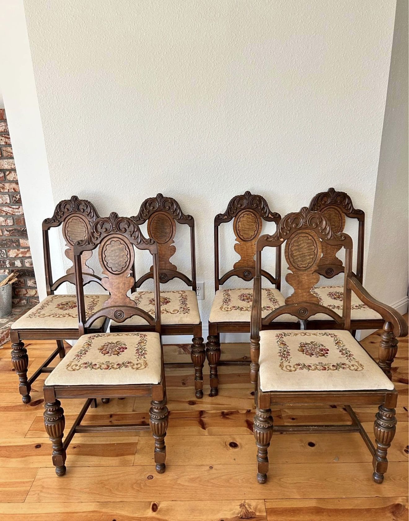 5 beautiful antique Jacobean dining chairs with hand embroidered seats. Set come with 4 regular chairs, 1 arm chair for host. There are some stains on