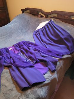Women's 2 PC. Jacket & Skirt. Jacket has Jewelled area that snaps In & out of Jacket, along with Sheer Long Sleeves