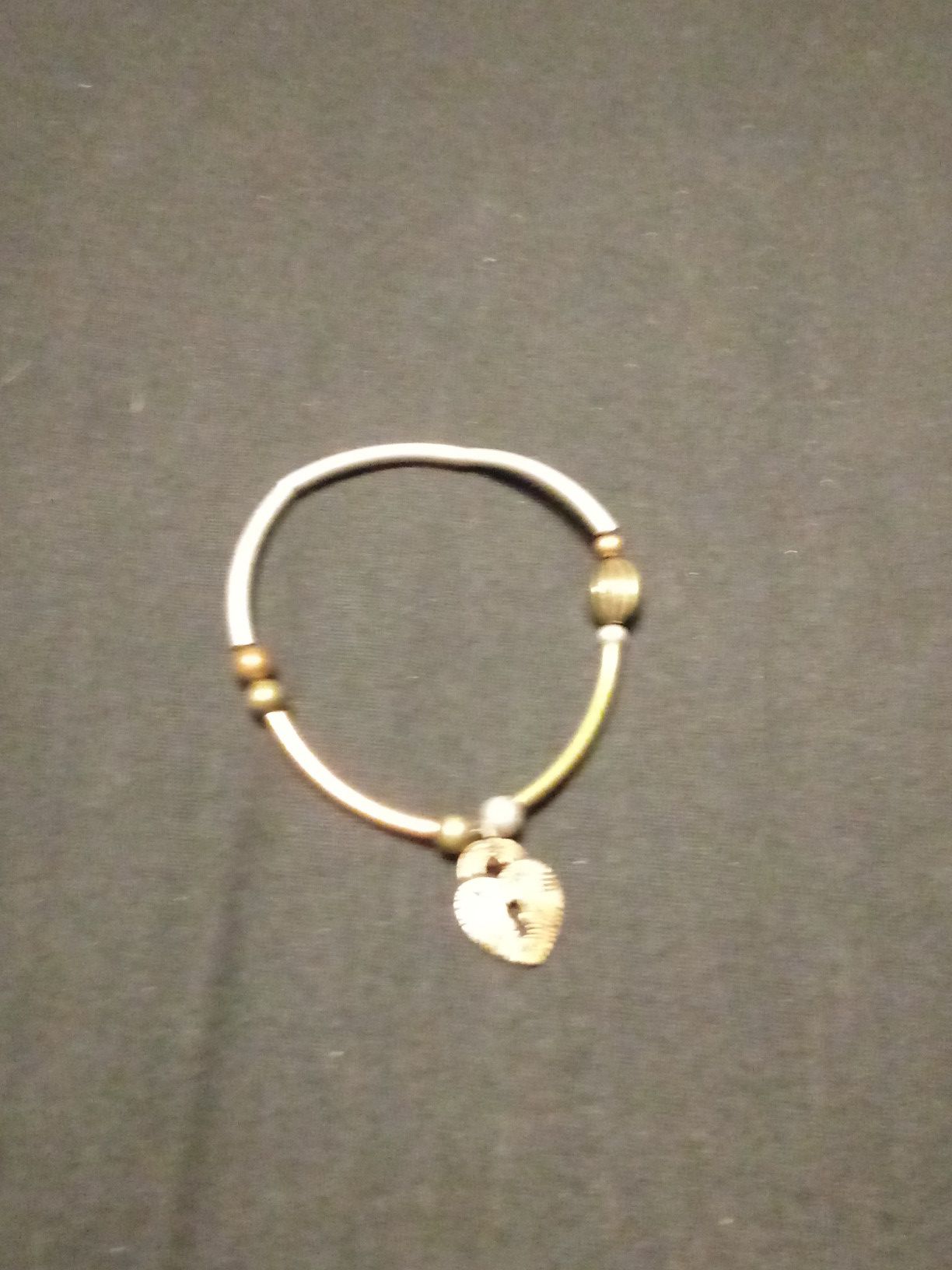 Brown beaded bracelet with lock charm