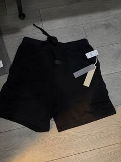 Black essientals fear of god shorts