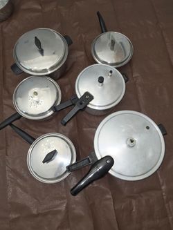 Set of 2 pressure cookers and Set of 4 Stainless steel pots