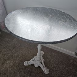 $175.00 - TABLE, CAST IRON/MARBLE TOP!  PICKUP THIS SATURDAY AT THE WOODLANDS IN MORROW COMMUNITY GARAGE SALE!