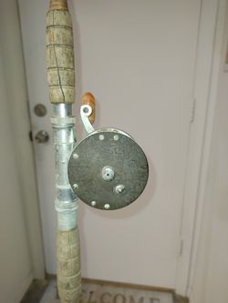 Three Vintage Fishing Poles