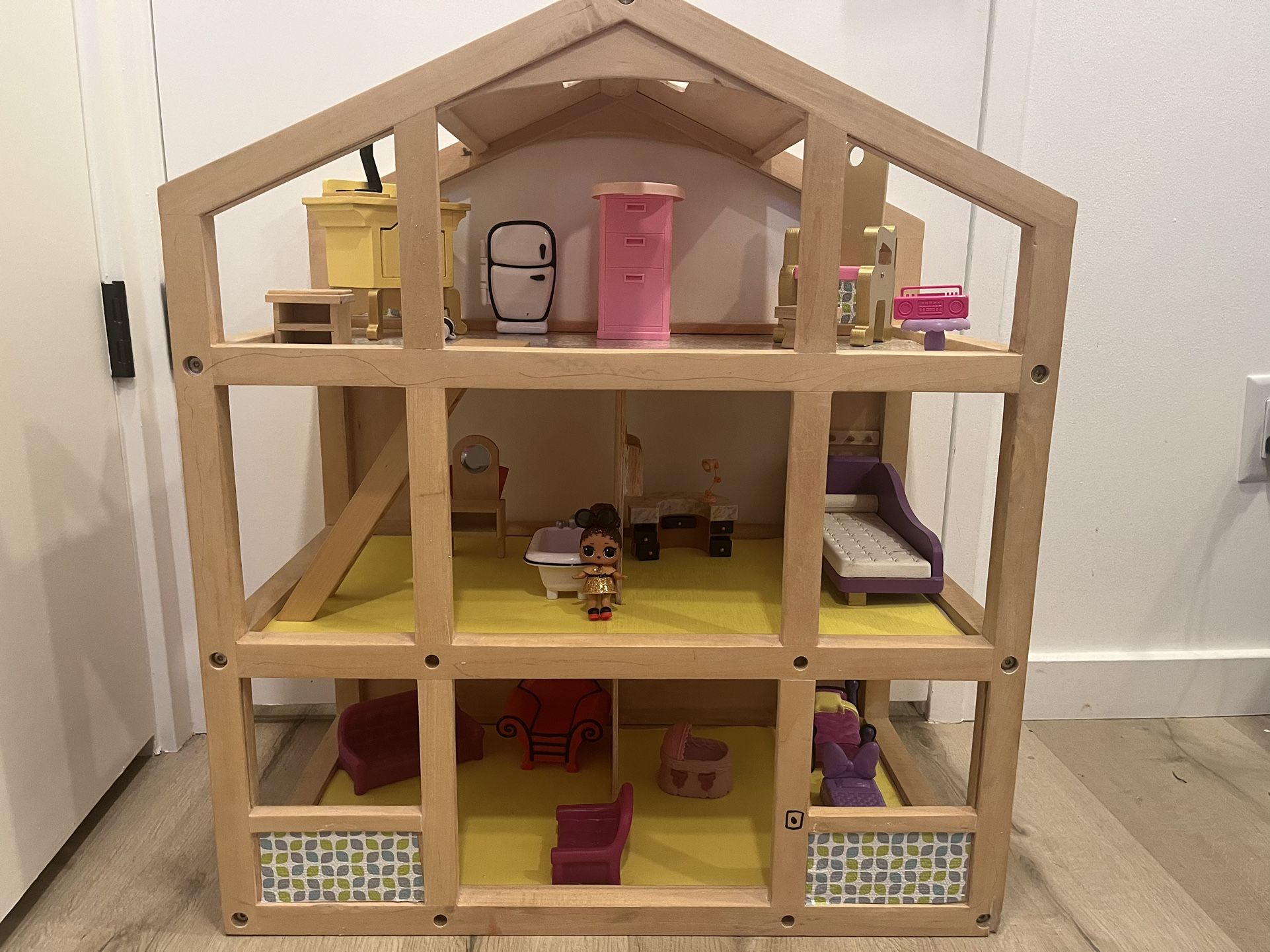 wooden dollhouse with furniture