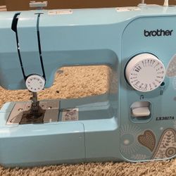 Brother Sewing Machine With Sewing Kit And Storage Papers And Some Fabric Included