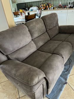 $250 Gray sofa with recliner and USB on each side