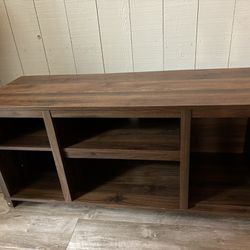 AmeriWood Home wooden brown TV stand with shelves measures 45.5” length x 16” width x 21” height 