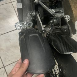 Surron Stock Light ,mud Guard And Purple Warp9 Direct Mount Riser