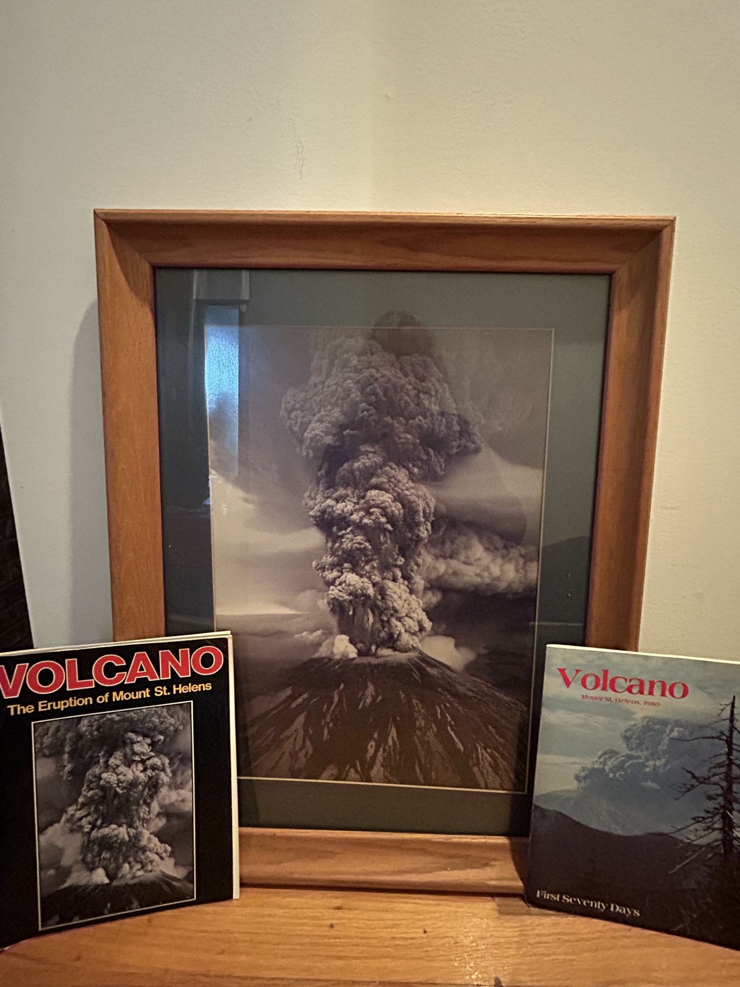 Framed picture of Mt. Saint Helens and 2 1980 magazines