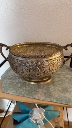Decorative brass bowl with footed pattern, $25