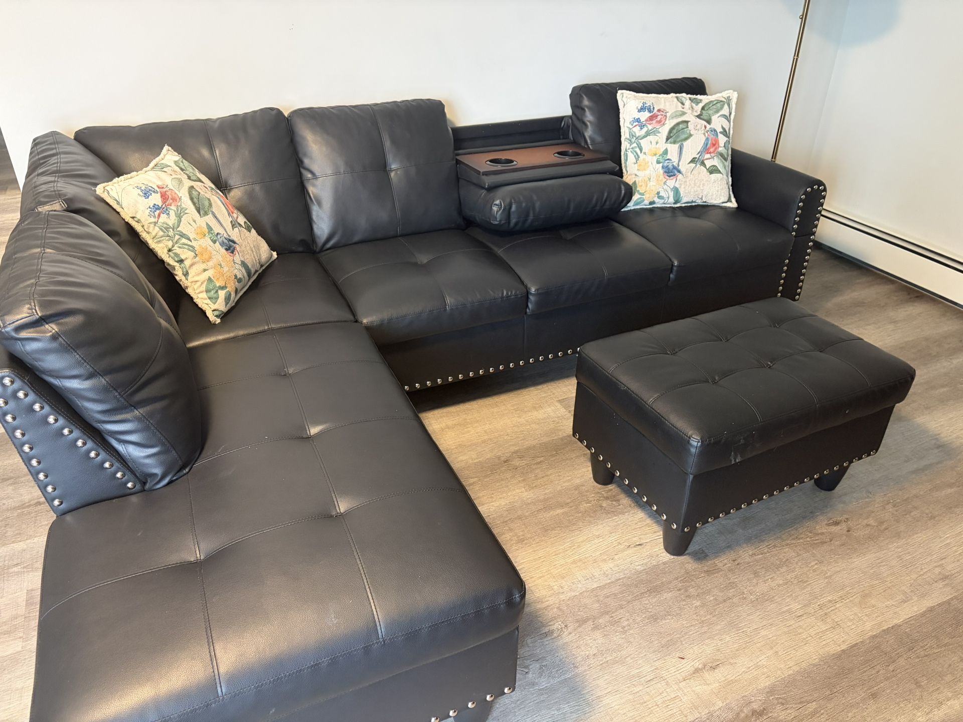 black leather sectional sofa with ottomon