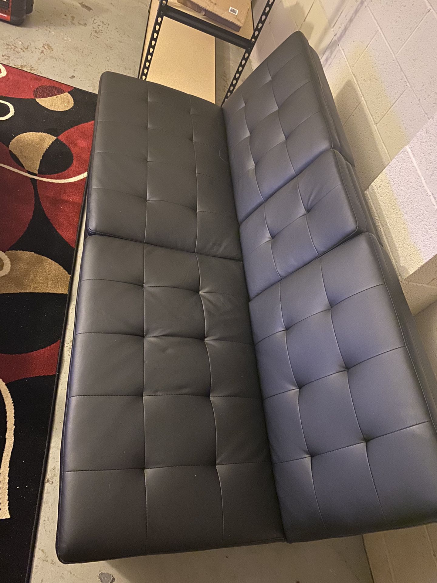 Black leather futon couch