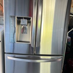 LG stainless steel refrigerator in good working conditions asking 36w 32d 70 tall