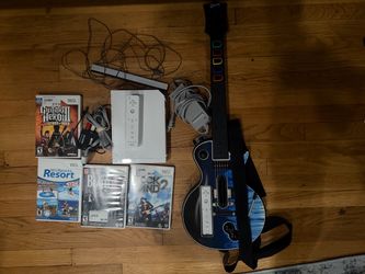 Nintendo Wii with Guitar hero Guitar and games