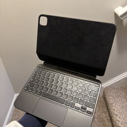 Magic Keyboard for iPad Pro 11-inch M4 and M5 with dbrand skin applied