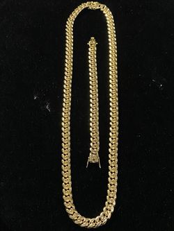 Brand new 3.16l stainless steel 14k gold plated chain and bracelet Cuban style the necklace is 28” length by 12mm wide the bracelet 8” length by 12mm