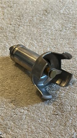 Robot Coupe 39335 Stainless Steel Bell Cover Assembly with an attached blade.