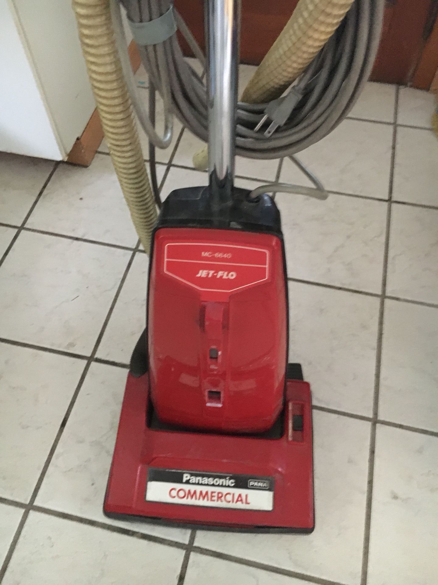 Panasonic commercial vacuum with extension Cleaning hose.
