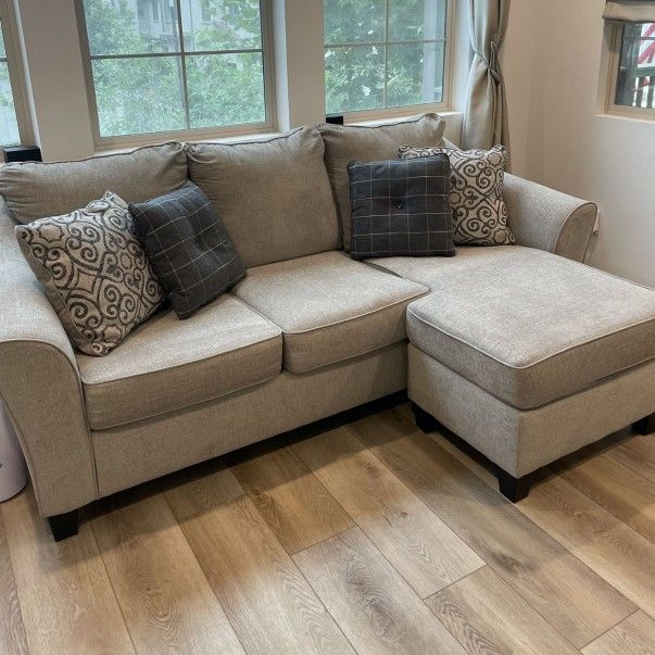 Light Gray Ashley Furniture Sofa with Flippable Chaise
