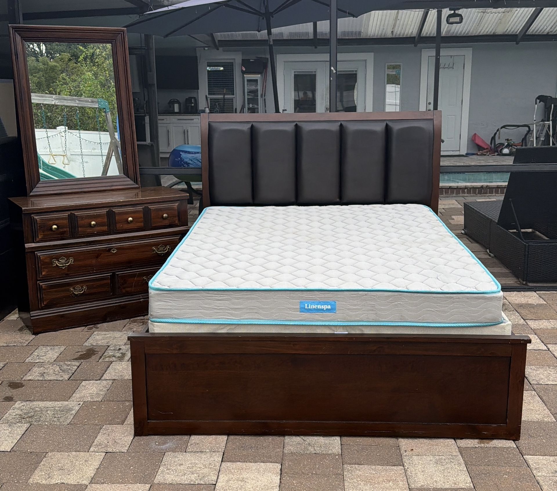 Beautiful Queen size bed with 4 drawers added, mattress, boxspring, Dresser and mirror. Delivery available for an additional cost.
