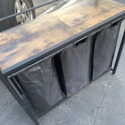 Hamper With (3) Compartments Black Material And Metal Frame Also Decorating Wood Top Usable For Items In The Bathroom Reduced From $40
