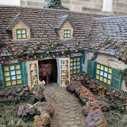 Hawthorne Village Studio In The Garden Designed By Thomas Kinkade.