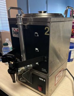 Hot beverage dispenser/warmer