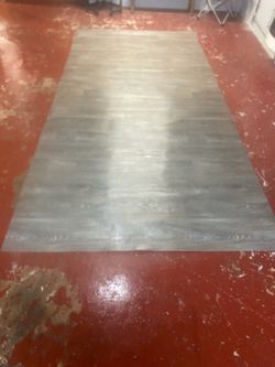 Laminate Flooring And Bucket Of Adhesive Glue