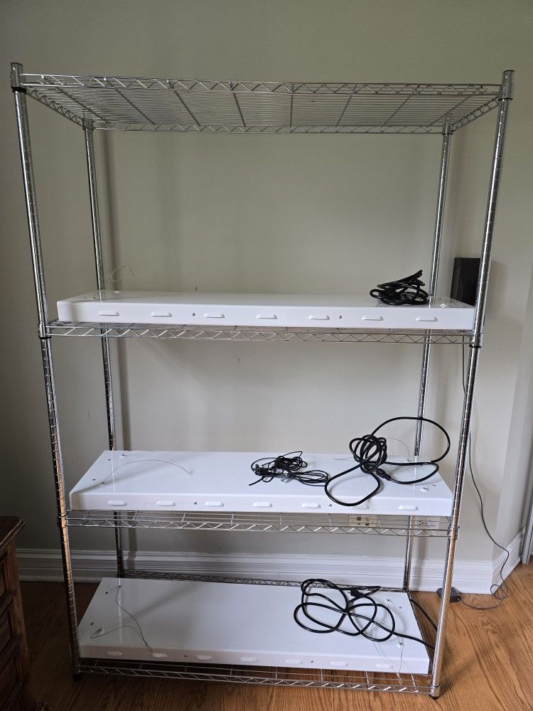 3 row adjustable plant stand with light fixtures and hoists