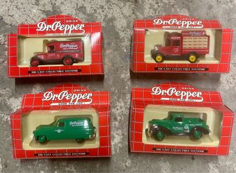 Set of 4 Dr Pepper die-cast collectible vehicles in original packaging.