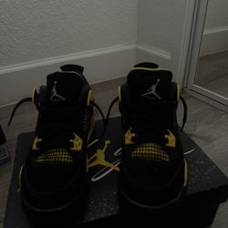 Thunder Yellow Jordan 4s 