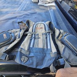 Vest for your fishing gear with many storage bags in front and back as new. 
