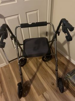 Walking aide with seat