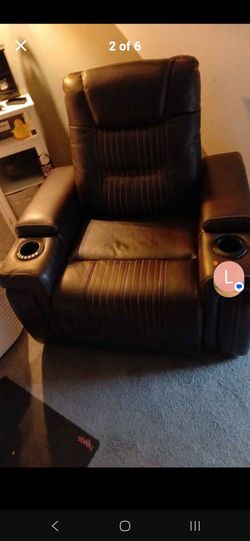 Brown leather recliner Electric with Lumbar and headrest adjustment and two cup holders that light up
