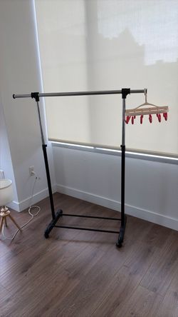 Rolling Clothes Rack with Adjustable Bar