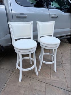 Set of 2 white swivel bar stools / counter height chairs