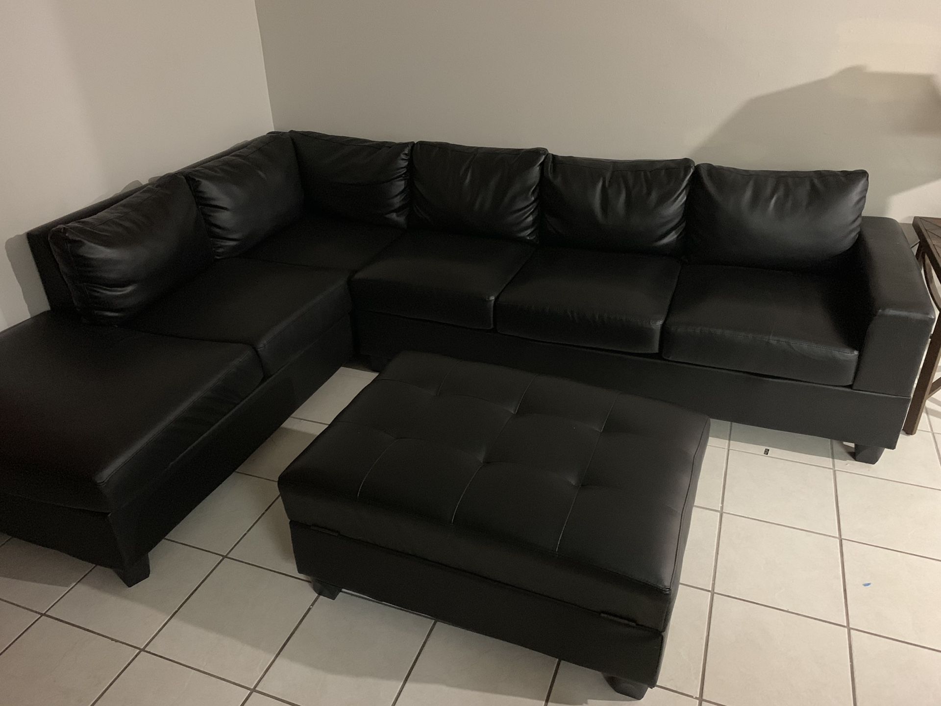 Black leather couch with centerpiece