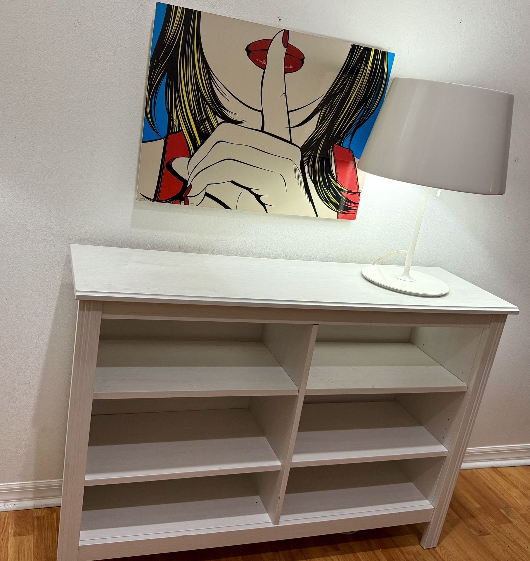 white wooden bookshelf / storage console** (bookcase** or **open shelving unit**).