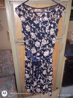 Candalite size small polyester and spandex dark blue with cream with white flowers designs  size small