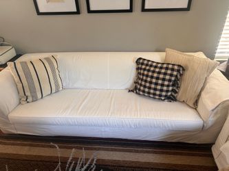 8ft white slip covered sofa