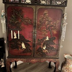 Asian Style Lacquer Cabinet Featuring Raised Hand, Painted Decorations
