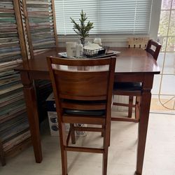 Dining table with four bar chairs