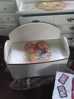 A hand painted & detailed wild cats storage sitting bench