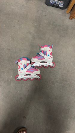 Pink White and Blue roller blades