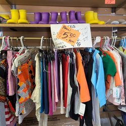 Children's rain boots $1 dollar children's clothing $1.25  Baby suit $5 each entire store 50% off