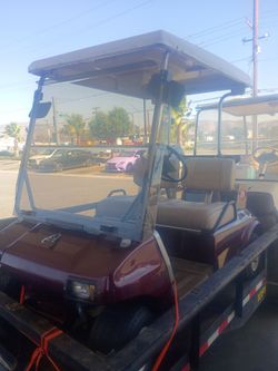 Burgundy electric golf cart leather seats hair conditioning back lights front lights