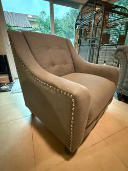 Grey upholstered arm chair