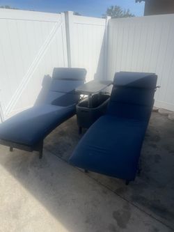Three piece  rattan chase loungers and table/cooler combo